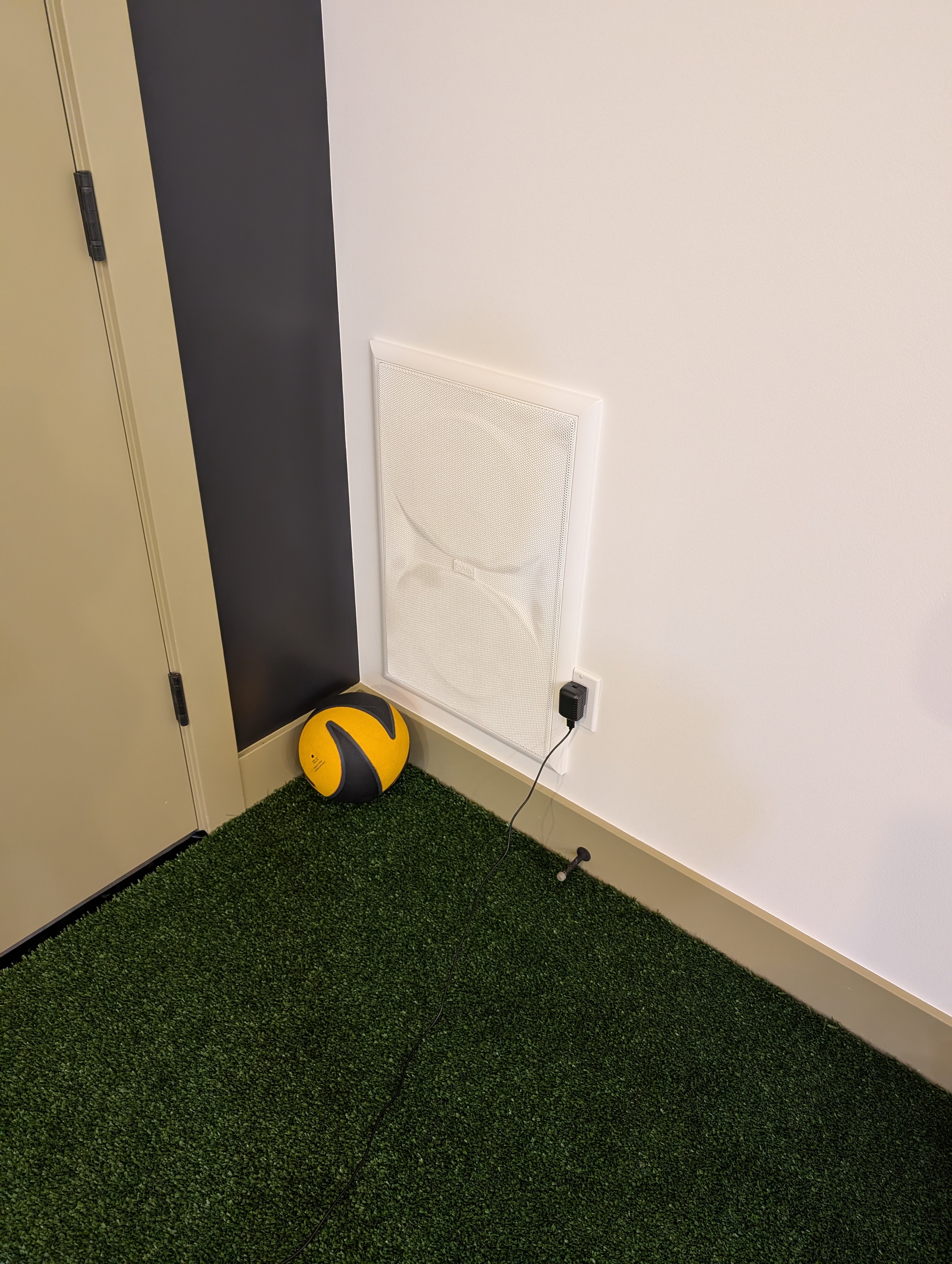 Flush in-wall technology integration in a finished room